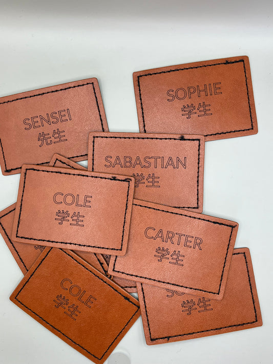 Engraved leatherette patches for hats, clothing and apparel.